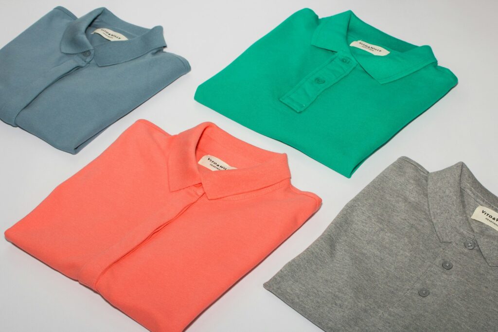Person wearing a tennis polo shirt