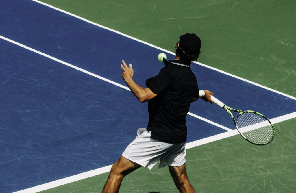 Man in a tennis outfit on a tennis court